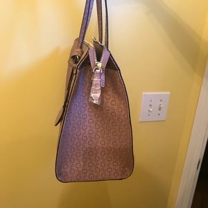 Guess satchel never been use